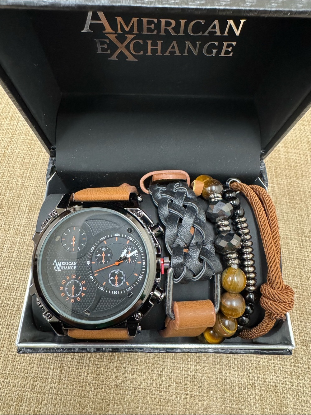 American Exchange Men's 4-Piece
Accessory Set Leather/Metal Watch &
Bracelets